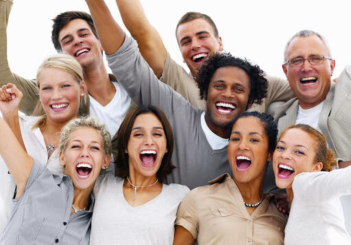 A Group of People Standing With Excitement in Light Color Clothes